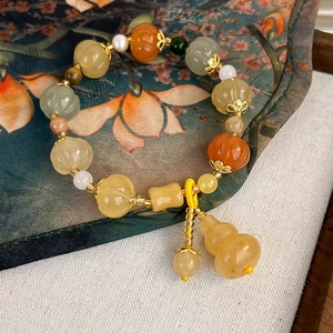 Minimalist pumpkin bead bracelet with jade gourd pendant in a zen vintage style