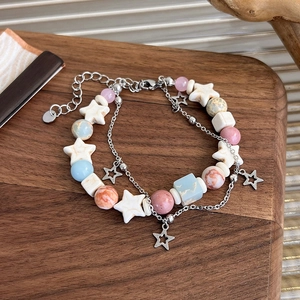 Double-layered beaded bracelet with colorful natural stone stars and silver metal charms