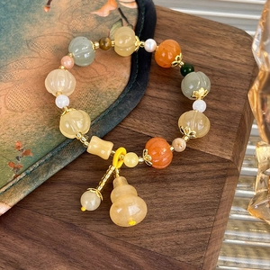 Chinese style beaded bracelet with colorful gems, freshwater pearls and yellow gourd charm