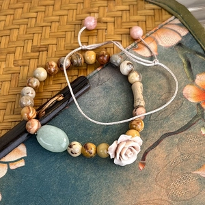 Vintage style beaded stone bracelet set with carved pink rose and adjustable woven cord