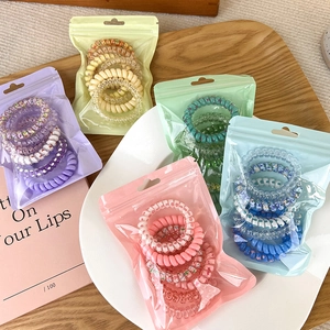 Elastici per capelli a spirale colorati in tonalità pastello viola, giallo, rosa e blu
