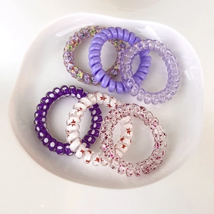Set di 6 elastici per capelli a spirale colorati con motivi floreali e glitterati
