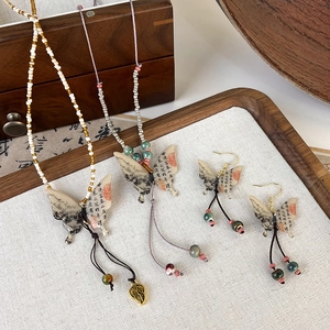 Ink butterfly tassel jewelry set with necklaces and earrings in traditional style