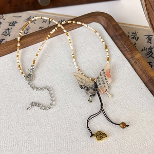 Detail of New Chinese style butterfly pendant necklace with ink painting and tassels