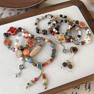 Vintage Chinese style ceramic bead bracelets with Zen wood beads and lotus pendant charm
