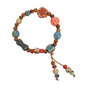 Ethnic retro handmade ceramic bead bracelet with tassels and artistic wooden beads