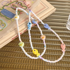 Colorful macaron ceramic beaded phone strap with cute fish and cat paw pendants