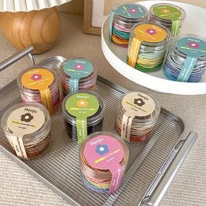 48-piece colorful high elasticity hair ties in a clear minimalist storage jar