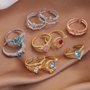 Set of 7 adjustable heart and star rings in gold, silver, and rose gold finishes