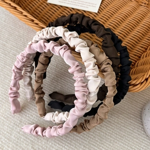 Five-piece set of earthy tone pleated satin headbands in pink, khaki, white, and brown