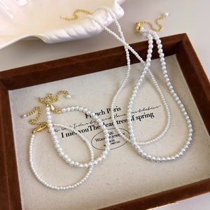 Elegant French style faux pearl necklace and bracelet set with golden adjustable clasps