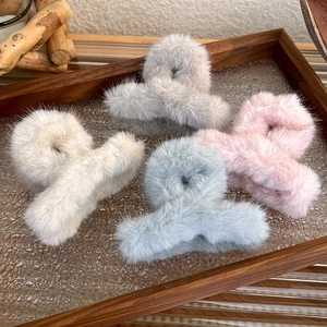 Set of four plush faux fur hair claw clips in pastel candy colors for autumn and winter