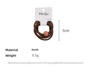 Detail view of 4-piece dark brown elastic hair ties with 5cm diameter and bead accent