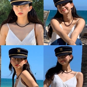Minimalist black beaded necklace and sailor hat set shown in multiple beach perspectives