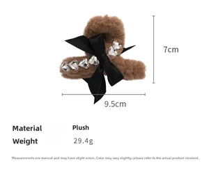 Detail view showing plush hair claw clip dimensions 9.5x7cm with rhinestones