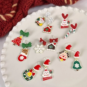 Festive Christmas earrings collection featuring Santa, snowmen, and reindeer designs