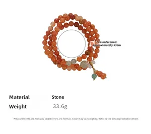 Detailed view of triple-layer orange stone bracelet with green agate and gourd charm