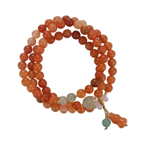 Multi-layer red agate bead bracelet with green charms and a small gourd pendant