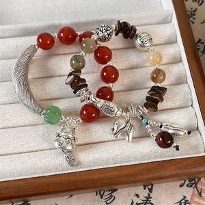 Ethnic style beaded elephant bracelet with red agate and yellow citrine in a jewelry box