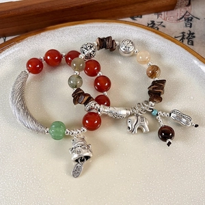Ethnic style red agate beaded bracelet with silver elephant and lucky cat charms