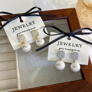 Elegant zircon crystal pearl earrings with geometric design in gold and silver finish