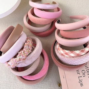 Pink Morandi high-top wide headbands in various textures like velvet and knit