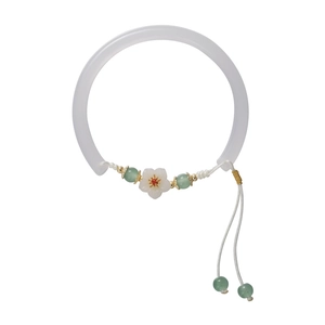 Vintage Chinese flower charm bracelet with white floral accents and green jade beads