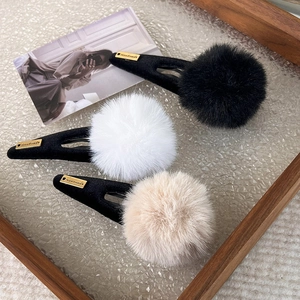 Chic plush ball hair clip set in black white and beige with handmade metal label