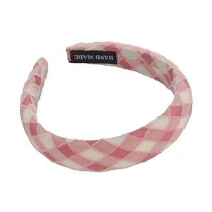Pink and white gingham wide headband with handmade label on white background