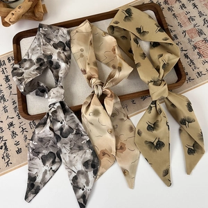 Three elegant vintage style silk hair ribbons with floral patterns in classic oriental design