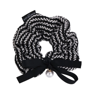 Elegant knit scrunchie with black white chevron pattern, bow and pearl charm accent