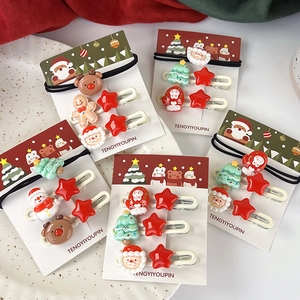 Set d'accessoires de Noël pour cheveux avec pinces Père Noël et rennes sur carton décoratif