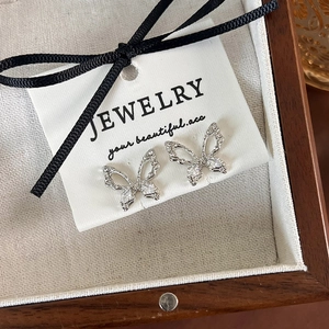 Elegant silver butterfly earrings with sparkling zircon stones in a premium jewelry box