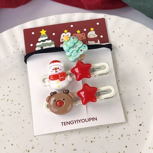 Détail du lot de barrettes de Noël avec bonhomme de neige, étoile et élan sur carte