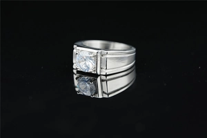 Macro view of men's titanium steel ring with moissanite in a square four-prong setting