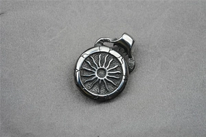 Macro view of vintage silver sunburst pendant with retro industrial textures