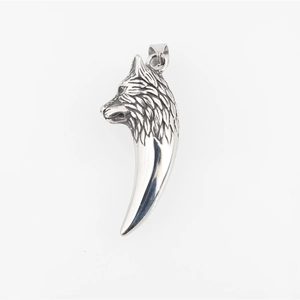 Vintage stainless steel wolf head pendant with punk tooth design on white background