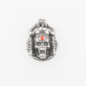 Gothic punk skull pendant with spiral horns and red gemstone in vintage silver finish
