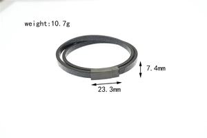 Close-up of double-layer black leather bracelet with brushed grey magnetic metal clasp