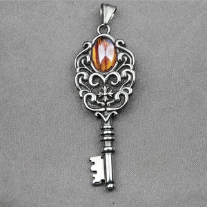 Vintage steel cross key pendant necklace with amber gemstone and retro floral engraving