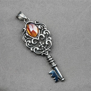 Retro stainless steel key pendant necklace with embedded red gemstone and intricate floral carving