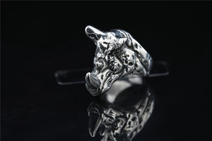Macro shot of 3D vintage silver rhino head ring with detailed animal textures and horns