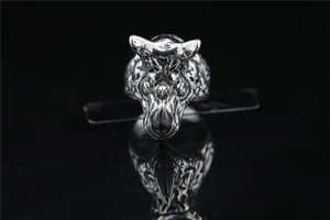 Close-up of vintage silver rhino head ring with detailed oxidation for men's punk style