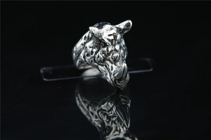 Macro shot of 3D rhino head ring with vintage texture and polished silver finish detail