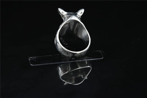 Macro detail of vintage silver rhino head ring showing textured inner band and antique finish