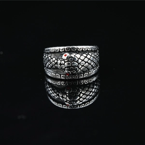 Vintage snake skin textured ring in black silver with red gemstone eyes and scales