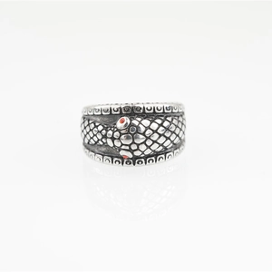 Vintage silver snake ring with scale texture and red gemstone eyes for men