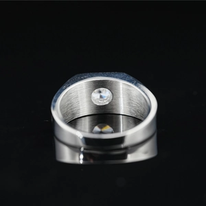Classic men's moissanite ring with brushed metal interior and round cut solitaire stone