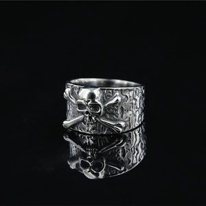Gothic punk skull and crossbones ring for men in silver finish with vintage texture