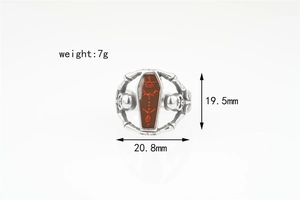 Macro view of gothic coffin ring with skull details and precise dimension marking